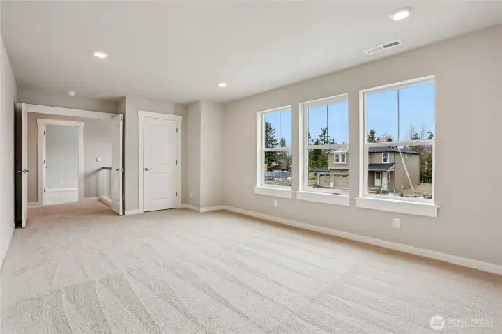 Large upper floor bonus/media room faces South with lots of light!