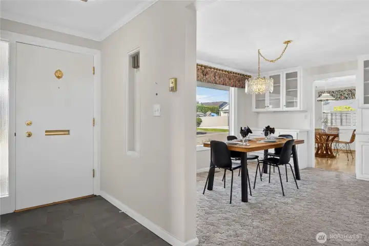 Entry leading into the formal dining area with built-ins