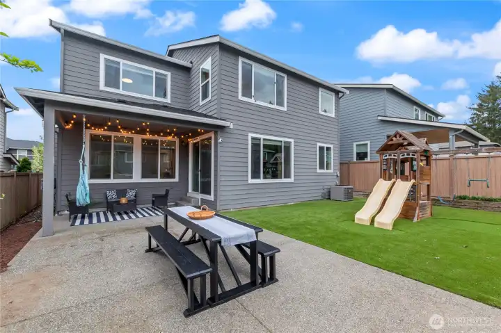 Low maintenance back yard! Expanded patio and artificial turf make for easy upkeep.
