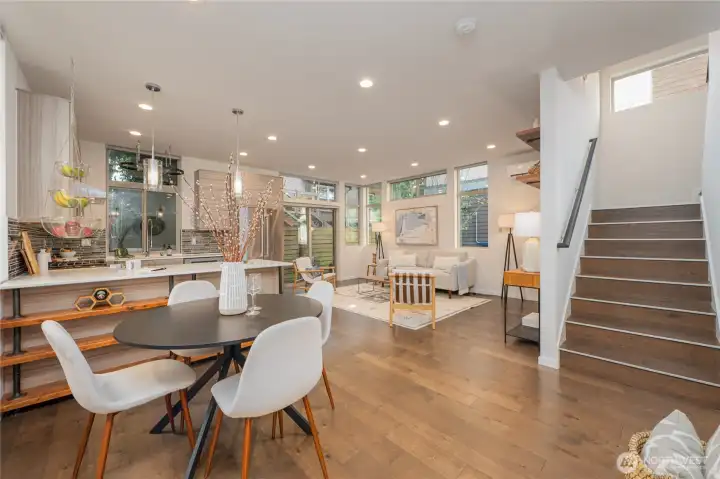 Main floor surrounded by windows. Hardwood floors on main and throughout the stairwell.