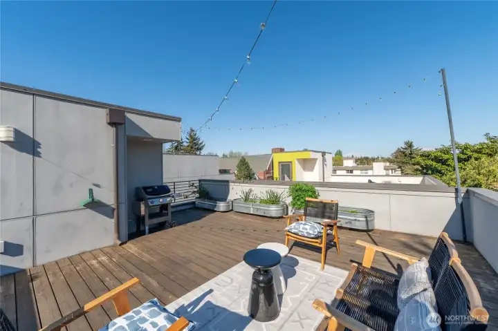 The deck has hook-ups for water and gas. And yes, the BBQ stays, just in time for summer :)