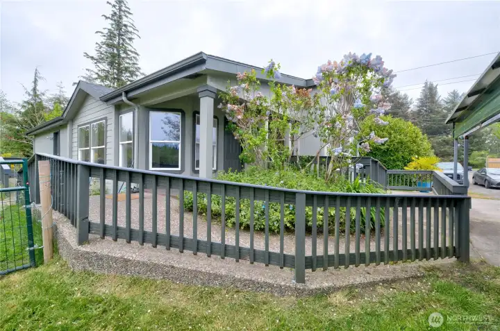 aggregate sidewalk ramp leading to the front door and back yard
