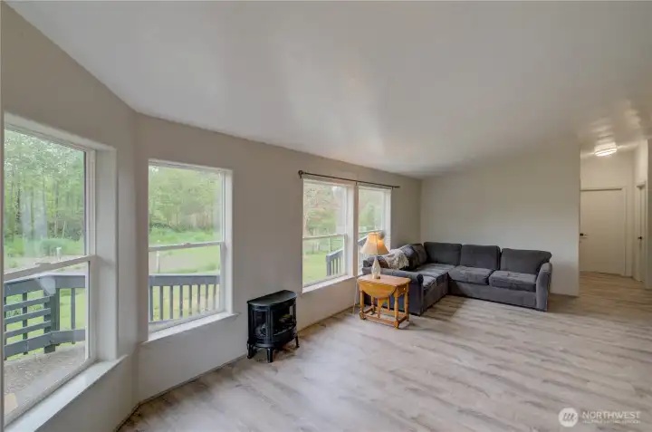 large picture windows bring in all the natural light with beautiful view and no neighbors!