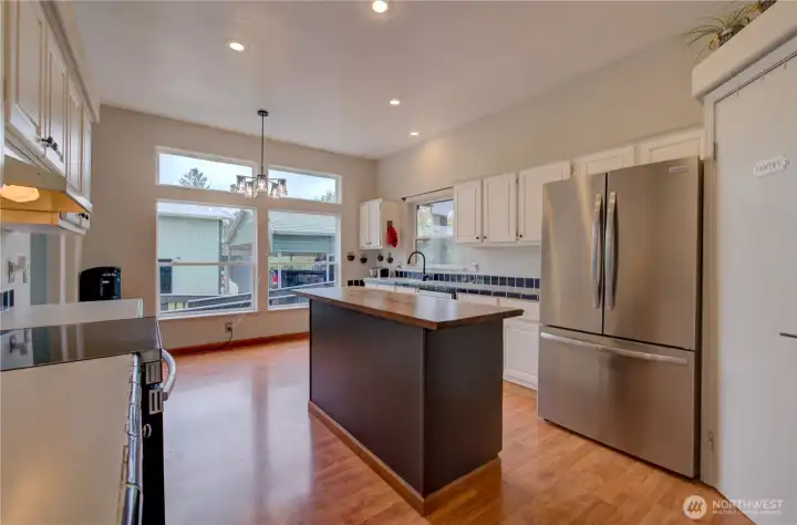 newer stainless-steel appliances, nice live edge island