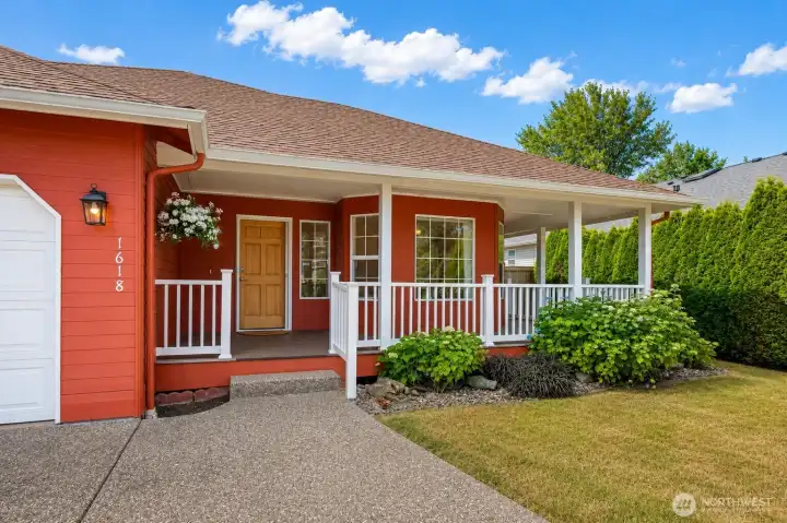 Attractive curb appeal highlighted by a welcoming wrap-around porch.