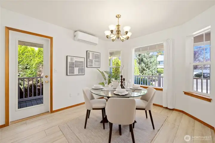 Dedicated dining area framed by wrap-around porch views and natural light.
