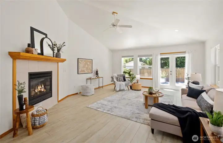 French doors invite natural light and connect the great room to the private patio.