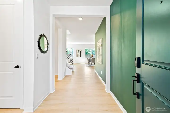 Dramatic front entry with wide and sunlit hallways