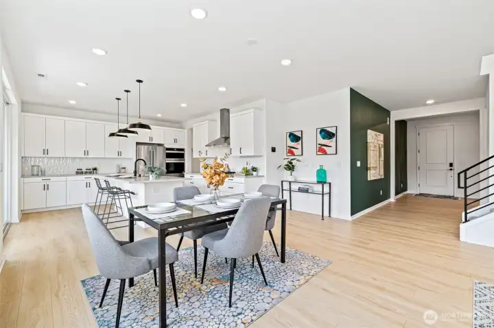 Dining area adjacent to kitchen and great room, ideal entertaining spaces