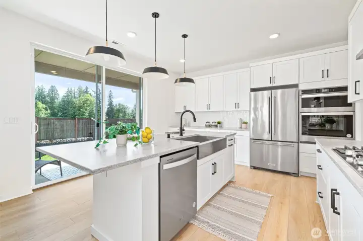 Large kitchen with custom hard surface countertops