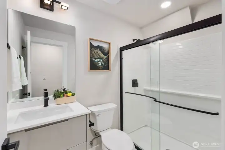 Main-level ¾ bathroom offers added flexibility and ease of living.