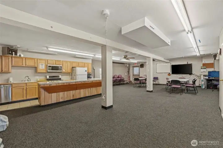 Lower level is currently used as a clubhouse. Walls can be replaced to create two more bedrooms.