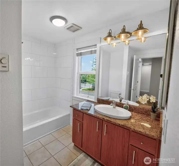 Primary bath which also has a door to the hallway