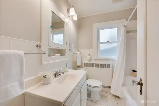 Main floor bathroom with beautiful, period/original tile flooring.