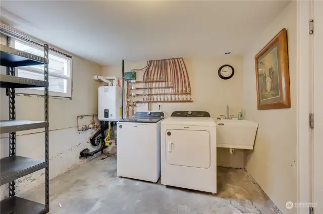 Laundry area and radiant heat system that provides clean and efficient heating throughout the house, plus an on-demand hot water so you will not have to hurry when enjoying your long, hot shower.