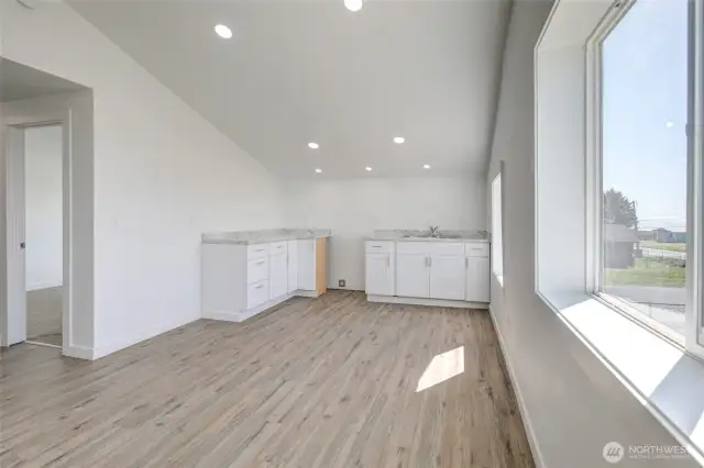 Upper great room with kitchen.