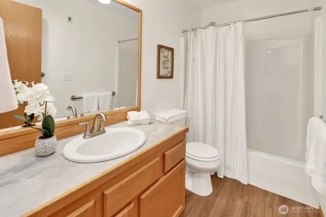 Full bath with tub/shower combination.