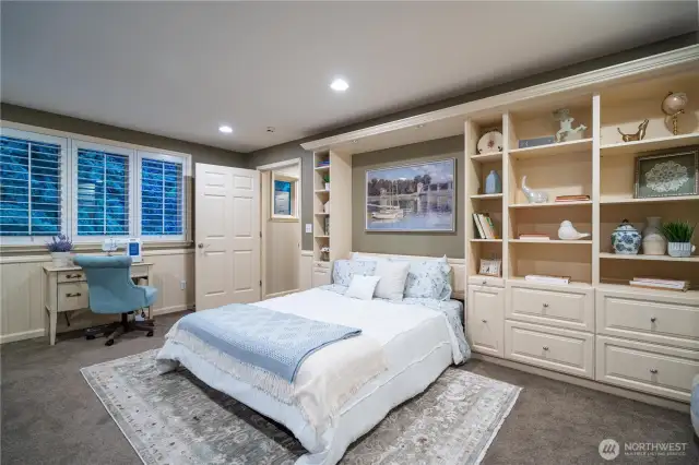 Additional guest suite/workout room/hobby room with Murphy bed, built-in shelving, and built-in closet. (Murphy bed and workout equipment included).
