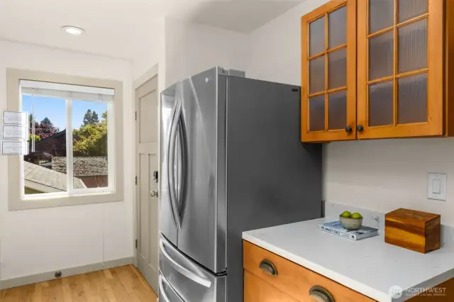 Stainless Steel Appliances. The door to the right leads to the interior staircase down to the ADU/ lower level.