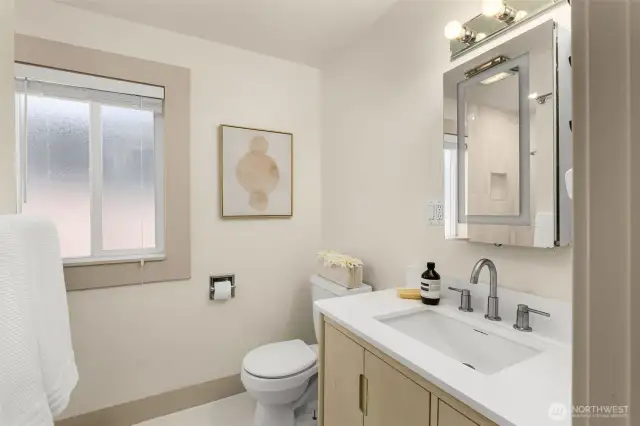 Main level bathroom was beautifully remodeled in 2025 with new ceramic tile and updated plumbing.