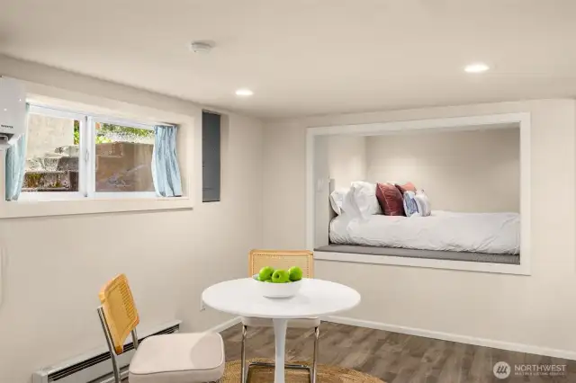 Dining room with a lofted bed area and closet nook.