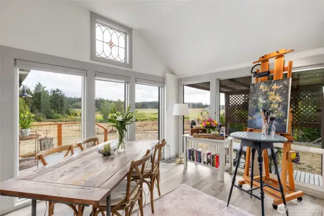 Dining with a wall of windows in the dining or inspiration for art.