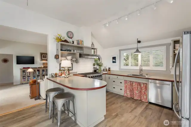 New floors, appliances, open shelving.