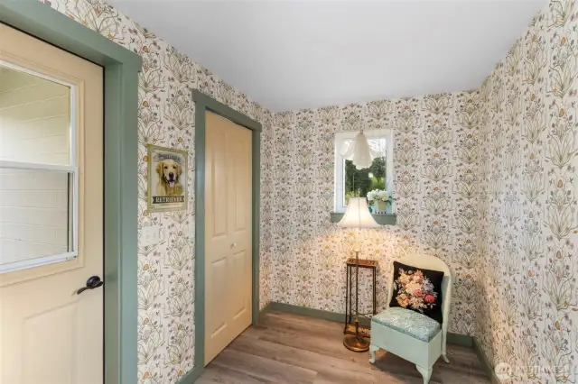 Mudroom with walk-in pantry and backdoor to open deck and views of the property.