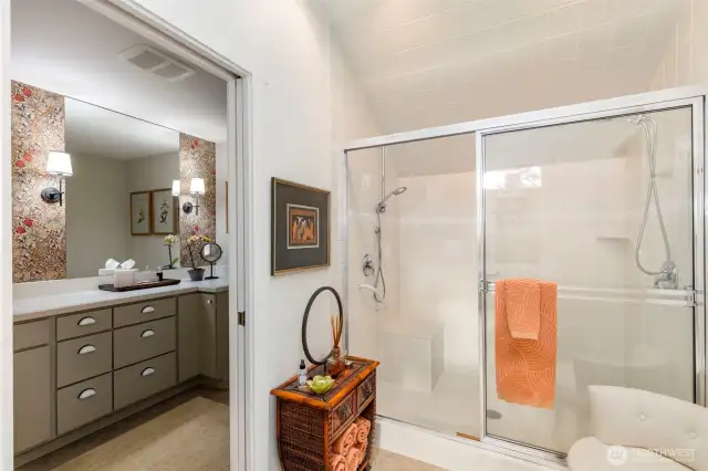 Double sink in the primary with shared shower - private with pocket doors on either side.