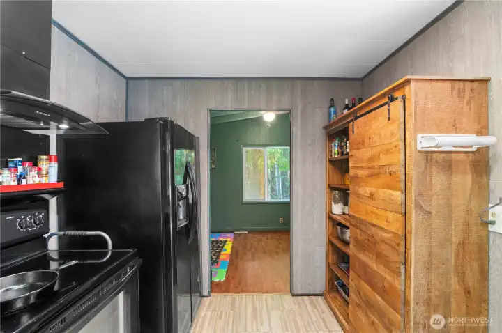 Entry to bonus room off the kitchen.