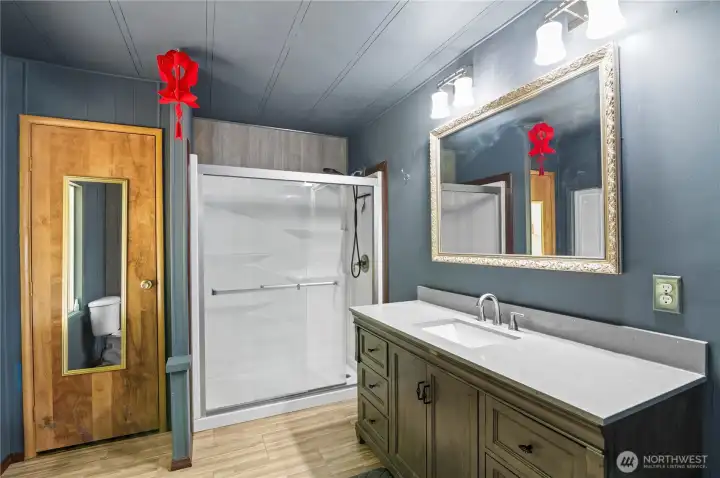 Large shower and updated vanity.
