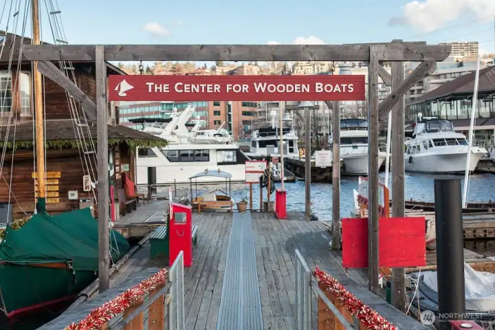 A short stroll brings you to The Center for Wooden Boats, where maritime heritage comes alive through hands-on exhibits, boat rentals, and one of Seattle’s most scenic waterfront parks.