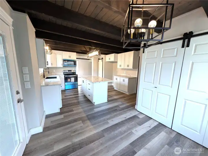 New cabinets, quartz counters, new trim, flooring & light fixtures.