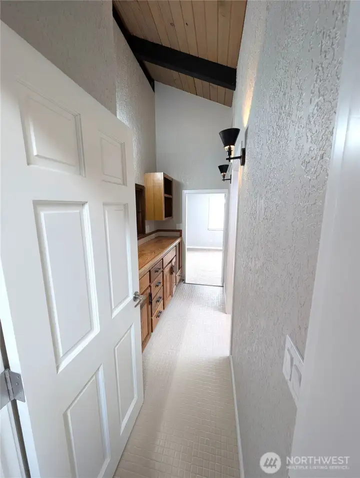 Hallway between the primary bedroom & 2nd upper bedroom.