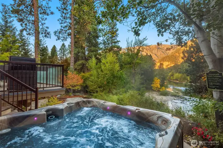 Private hot tub setting with mountain views—perfect for unwinding while taking in the natural beauty of the surrounding landscape.