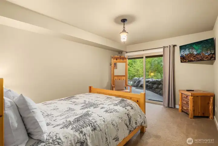 Lower level bedroom with walkout slider to Patio