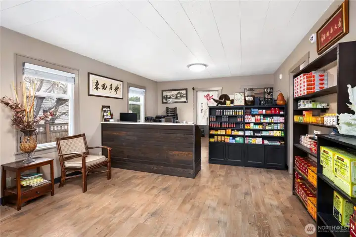 Welcoming front lobby and reception area that can easily function as a living room and dining space.