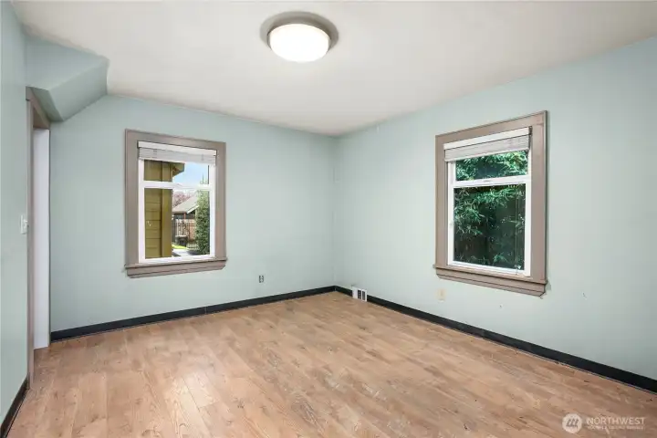 Versatile second office on the main level that can also function as a primary bedroom.