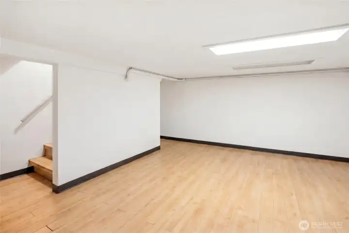 Workroom / Prep Area or  Family room with newer hardwood floors. Huge value for business users (storage is gold).