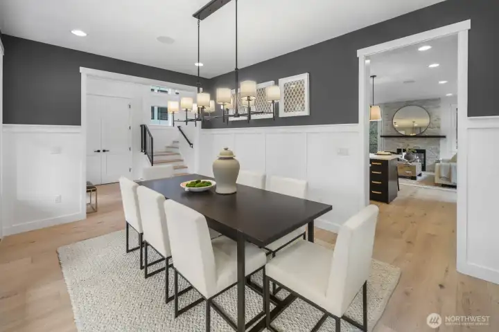 Another view of the dining room highlights its generous proportions, classic millwork, and seamless connection to the surrounding living spaces.