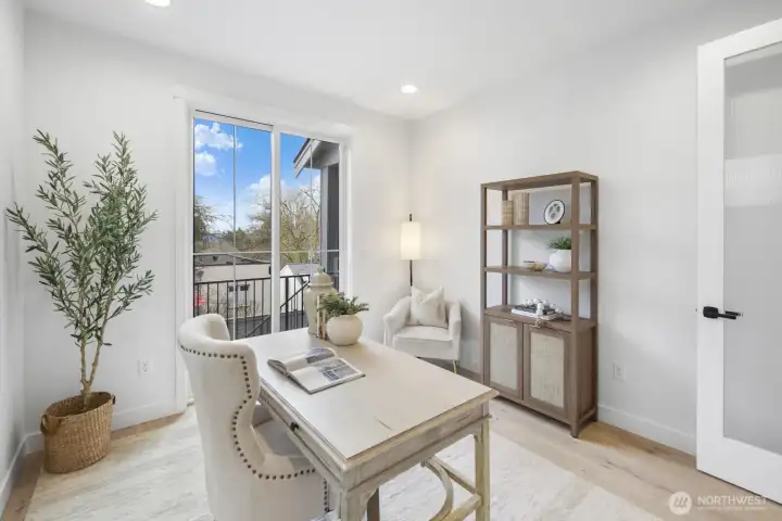 Bright and thoughtfully positioned, the main-floor den offers a refined work-from-home setting with flexibility for study, reading, or quiet retreat.