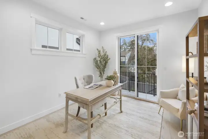 A second look at the den highlights its versatility and natural light, offering a calm, private space just off the main living area.