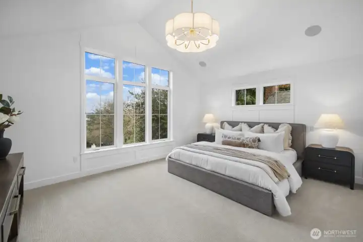 The primary suite feels calm and expansive, with abundant natural light and a serene atmosphere that elevates everyday living.