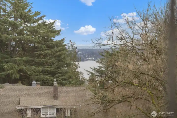 Filtered lake views create a beautiful backdrop, adding a quiet sense of retreat to the upper level.