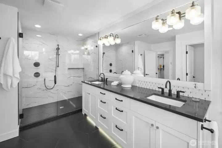 Spa-inspired and beautifully scaled, the primary bath pairs a generous dual vanity with a large walk-in shower for a polished, retreat-like feel.