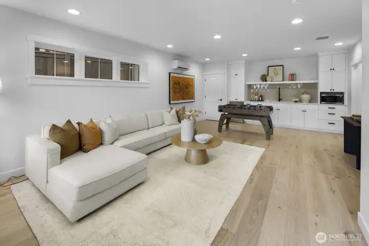 Another angle showcases the scale of the lower level, where lounge space and game room potential make this a standout extension of the home.