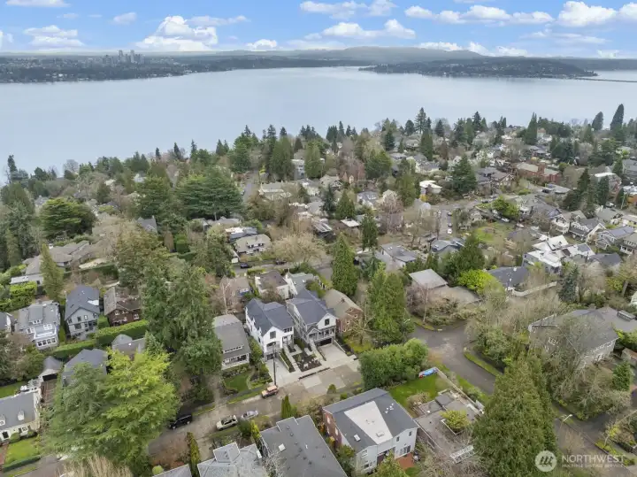 An aerial perspective captures the home’s exceptional Denny Blaine setting, surrounded by mature trees, established streetscapes, and nearby lake views.