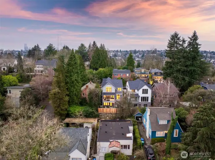 From above, the rear elevation showcases the home’s commanding presence, thoughtful outdoor living areas, and its seamless fit within this coveted neighborhood setting.