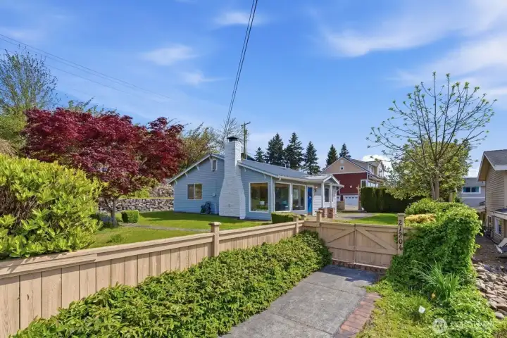 Another view front walkway approach from 3rd street. Mature landscaping and level areas to enjoy the yard and terracing in the back to take in the views.