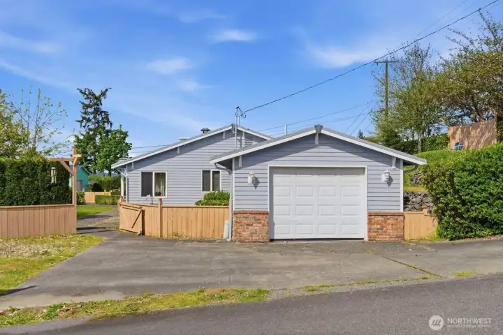 Home and garage off back street 112th. Fully fenced.